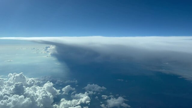 Unique pilot point of view of a huge and threatening cumulonimbus at 12000 metres high. 4K 60 FPS.