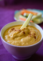 Delicious and healthy appetizer of roasted peppers cream with raw garnish