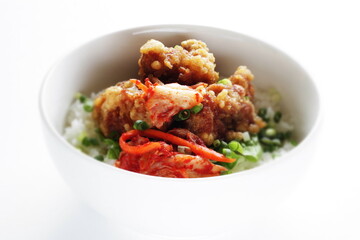 Korean style cafe food, fried chicken and Kimchi on rice with spring onion