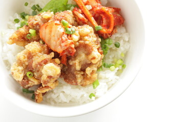 Korean style cafe food, fried chicken and Kimchi on rice with spring onion