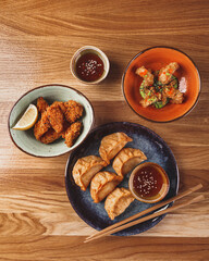 Set of assorted pan asian dishes. Chinese, Korean, Japanese cuisine. Soups, dumplings, noodles, rice and desserts.