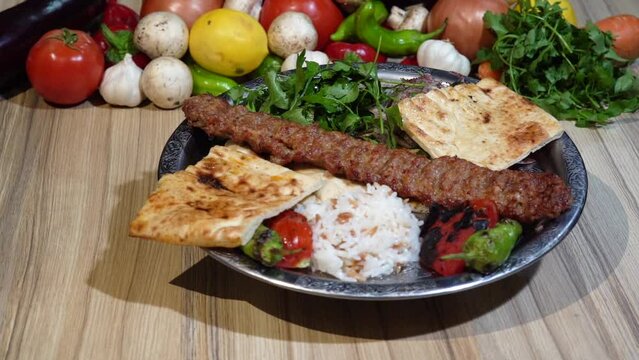 Adana kebab on the serving plate.
Adana kebab, traditional Turkish dish. On the serving plate.
