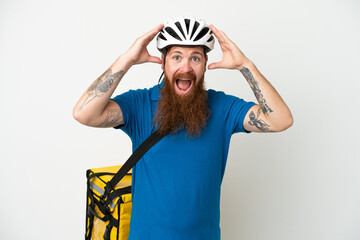 Young reddish caucasian man with thermal backpack isolate don white background with surprise expression