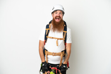 Young rock- climber reddish caucasian man isolated on white background with surprise facial expression