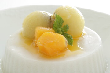Kiwi fruit and mango on white Milk Kanten Jelly for Asian sweet dessert image