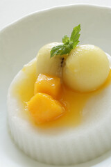 Kiwi fruit and mango on white Milk Kanten Jelly for Asian sweet dessert image