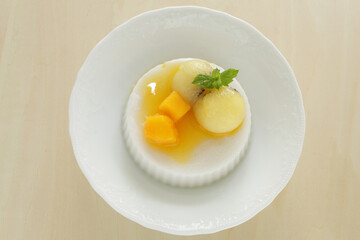 Kiwi fruit and mango on white Milk Kanten Jelly for Asian sweet dessert image