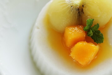 Kiwi fruit and mango on white Milk Kanten Jelly for Asian sweet dessert image