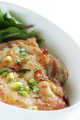 Homemade grilled chicken served with baby leaves and cherry tomato salad