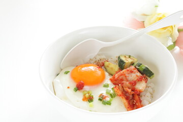 Korean food, deep fried zucchini and Kimchi with sunny side up fried egg on rice