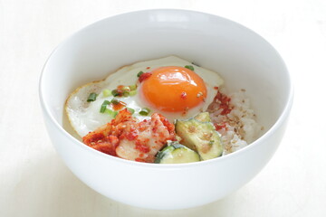 Korean food, deep fried zucchini and Kimchi with sunny side up fried egg on rice
