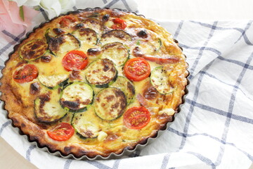 Homemade zucchini and cherry tomato with bacon quiche