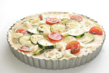 Prepared egg and pan fried zucchini in egg wash for  quiche cooking ingredient