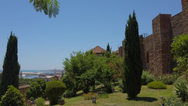 View of The Alcazaba a palatial fortification in M&aacute;laga at Midday, Spain - Islamic heritage sites  in Andalusia. 