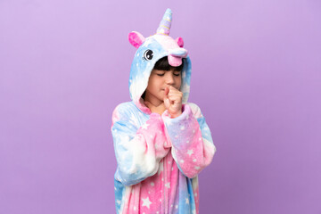 Obraz na płótnie Canvas Little kid wearing a unicorn pajama isolated on purple background is suffering with cough and feeling bad