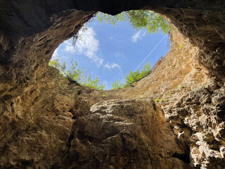 Bottom up view of natural well of karst-tectonic origin known as Proval located on southern slope of Mount Mashuk in Pyatigorsk, North Caucasus, Russia