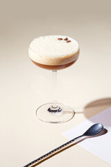 Cold alcoholic or non-alcoholic cocktail on pastel background. Hard light, deep shadow.