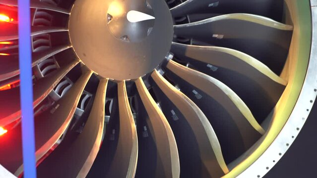 GTF type new generation aircraft engine slow motion shot of fan blades inspection with red lights effect