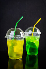 Cold summer lemonade with ice, lemon and mint. Cocktail to go