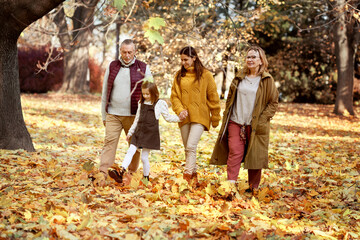 Family walking at the park in autumn