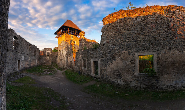 panorama of the nevytske castle. ruins of ancient fortress in evening light. popular travel destination of ukraine