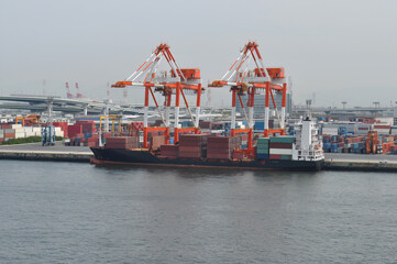 Fototapeta premium industrial port with containers. Container ship at sea port at terminal