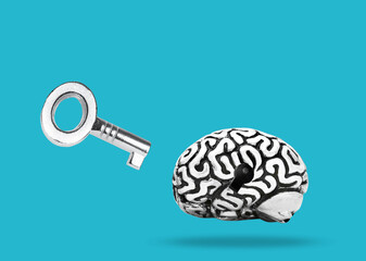 Small key and steel brain on blue