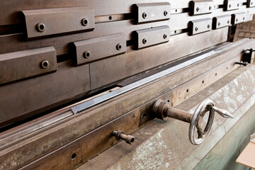 Sheet metal bending machine. Grain image effect.