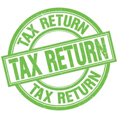 TAX RETURN written word on green stamp sign