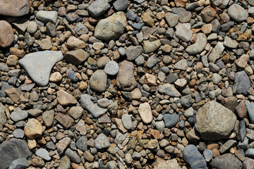 The texture of the surface covered with small rounded stones.