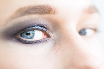 Fototapeta na wymiar Women's eyes with beautiful shining makeup.