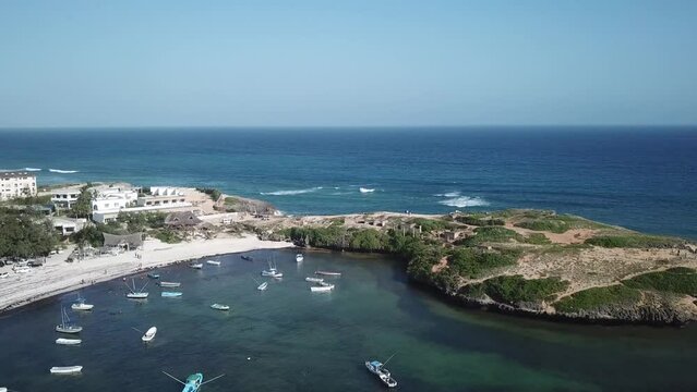 Sunny day at Watamu Beach, drone seascape of sandy beach, peninsula and beach resort, Kenya,  Africa