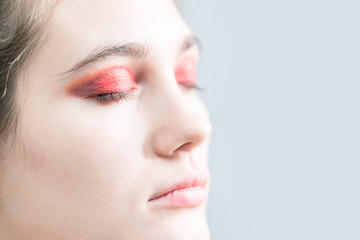 Closeup of bright makeup. Red eyeshadow.