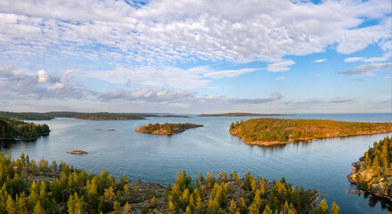 Republic Karelia. Lake Ladoga in Russia. Karelia from birds eye view. Landscape of northern nature on summer day. Panorama Ladoga Islands. Coniferous trees grow on rocks. Journey to Russians Karelia
