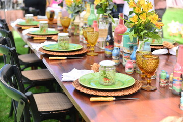 table setting for a lunch,  table set for festive event, decorated table, ornamental flowers