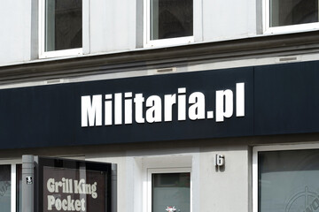 Fototapeta premium Militaria.pl store front, brand signage, logo detail, closeup, nobody. Military accessories business, military equipment store, no people