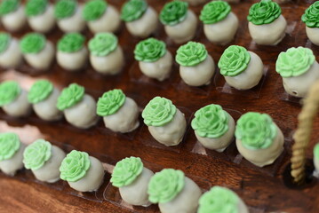 white chocolate pralines on the party table, condensed milk candy balls, candy balls