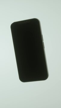 Black screen phone model spinning around, animated graphic