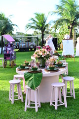 table set with flowers and pitombas regional fruits, ornamental flowers