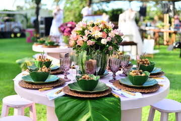 table set with flowers and pitombas regional fruits, ornamental flowers