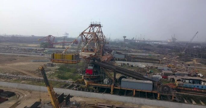 Flying To Combined Stacker And Reclaimer At Paradeep Port In Odisha, India. - aerial approach