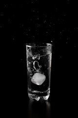 Glass of water filled with ice cubes