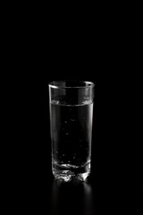 Glass of water filled with ice cubes