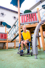 A disabled person in a wheelchair on the swings of a playground having fun