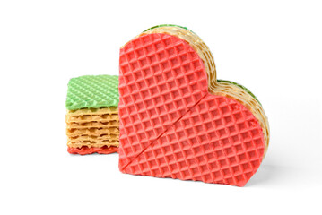 Colorful pieces of waffle cake isolated on white background.