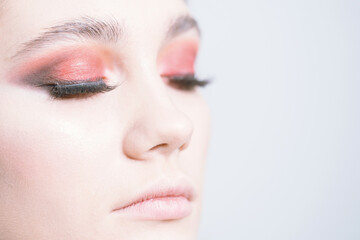 Fototapeta premium Bright red makeup close-up. On a white background.