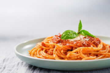 Spaghetti with bolognese sauce in a plate with copy space