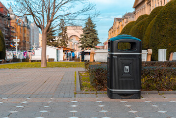 Black trash can on the street for recycling and for dump in the city center
