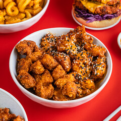 Fried Seasoned Chicken, Sesame Seeds, Sticky BBQ, Burger, Curly Fries, Chopsticks, Asian Style, Korean, Chinese Food Photography Red Backdrop