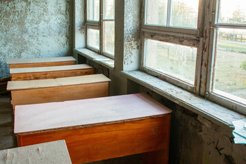 School classroom, with empty benches in an abandoned Soviet school in Martvili, Georgia. 